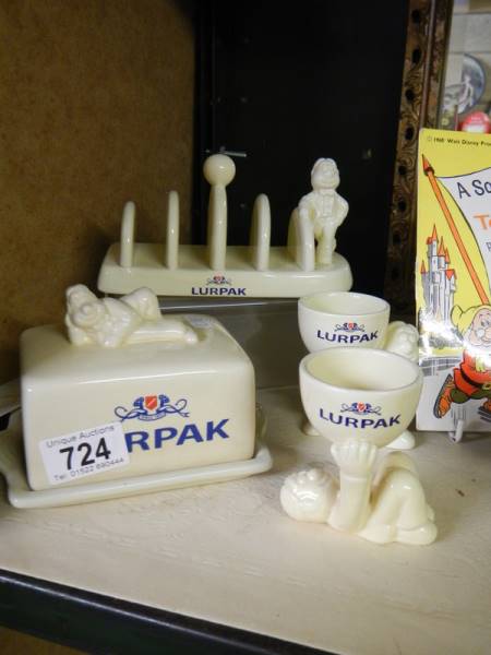 A Lurpack butter dish, toast rack and two egg cups.