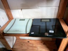 Two sets of bathroom scales.