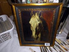 A framed study of a horses head.