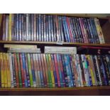 Two shelves of assorted DVD's.