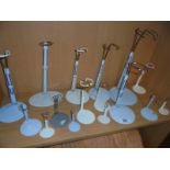 A quantity of doll stands.