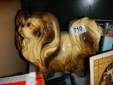 A Pekinese dog figure.