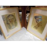 A framed and glazed print of Tut-ankh-amun and another of Nefertiti.