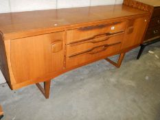A retro teak sideboard. COLLECT ONLY.