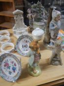 A mixed lot of figures, napkin rings etc.,