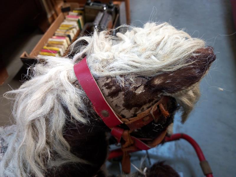 A vintage straw filled rocking horse on folding wheels - Image 5 of 5