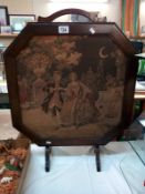 An Edwardian oak frame fire screen with Classical tapestry centre panel