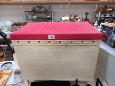 A vintage loom linen box with upholstered top