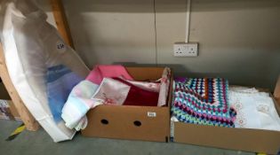2 boxes of sheets, single duvet cover, crocheted blanket etc