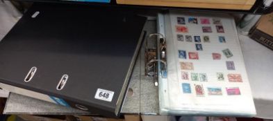2 folders containing stamps