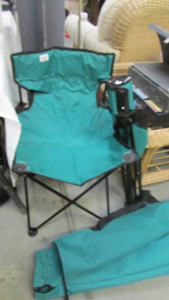 Two boxed folding camping chairs.
