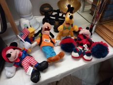 A quantity of toys from Walt Disney world including Mickey and Minnie Mouse