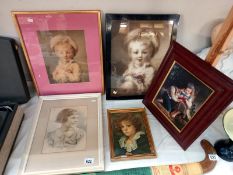 A selection of picture frames various sizes containing portraits