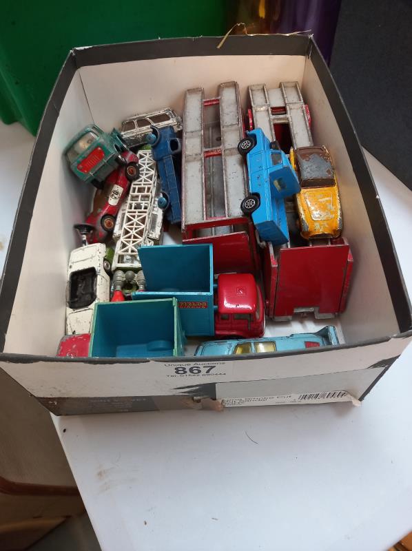 A box of play worn die cast including Dinky 984 transporter, Space 1999, Avengers, Lotus,