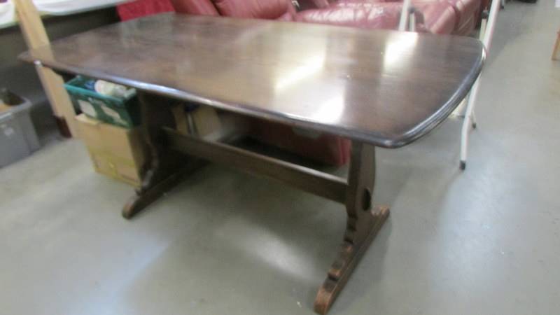 A dark oak refectory style dining table, 130 x 77 x 86 cm high.