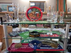 A quantity of breweriana including bar mats, ashtrays & glasses