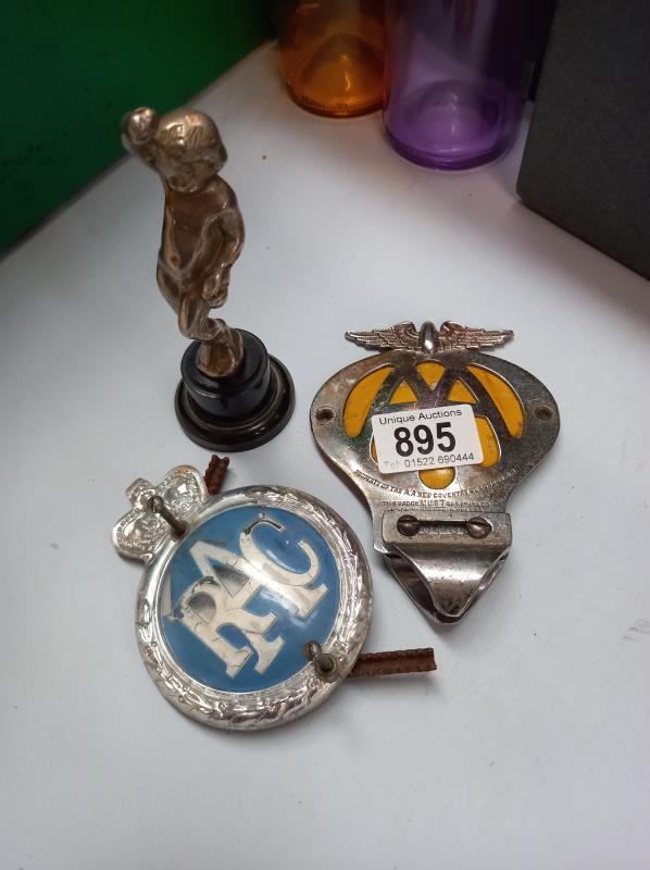 An AA & RAC car badges & a cherub car mascot