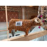 A signed pottery Highland cattle ornament