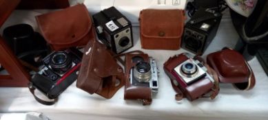 5 cased vintage cameras