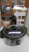 A boxed Morphy Richards soup maker and a slow cooker.