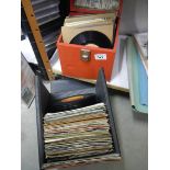 A quantity of 45 rpm records and DVD's.