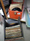 A quantity of 45 rpm records and DVD's.