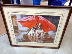 A framed print of dogs under an umbrella
