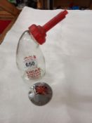 A vintage Lucas glass battery filler bottle and a Great Britain car badge.