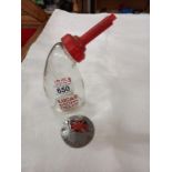 A vintage Lucas glass battery filler bottle and a Great Britain car badge.