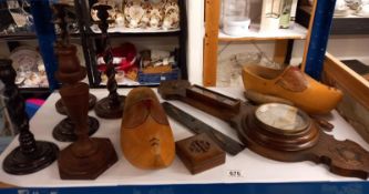 A barometer, clogs and wooden candlesticks.