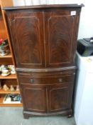 A dark wood stained 4 door cabinet with drawer & writing shelf, 61cm x 43cm x 130cm high