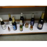 A quantity of small bottles of alcohol including wine.