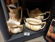 A Crown Ducal teapot, water jug, milk jug and sugar bowl.