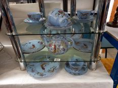 A blue patterned tea set with pheasant design