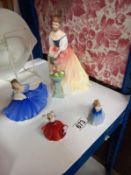 Four Royal Doulton figurines, Alexandra Hn3286, Elaine HN2314 and two miniature figures Elaine and