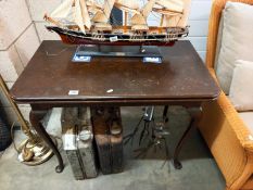 An Edwardian oak fold over tea/card table on Queen Anne legs, COLLECT ONLY.