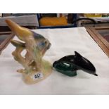 A Poole dolphin and a Jema Holland 1950's pair of angel fish ornament with sticker.