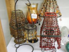 A shelf of table/candle lamps etc.,