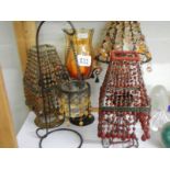 A shelf of table/candle lamps etc.,