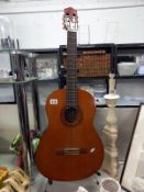 A Yamaha C-40 acoustic guitar (stand not included)