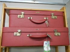 Two good red Antler suit cases.