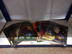 A quantity of Star trek and Stargate magazines.