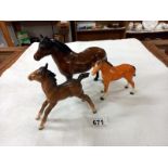 Three Beswick horses.