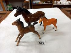 Three Beswick horses.