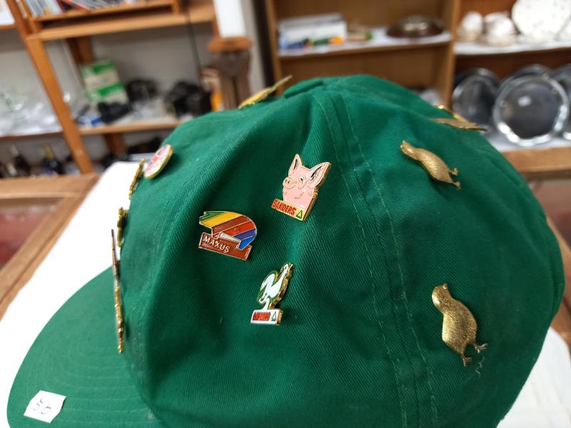 A quantity of badges on a cap. - Image 3 of 4