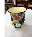 A vase with 2 shoulders, cream inside with painted flowers and leaves outside, numbers and