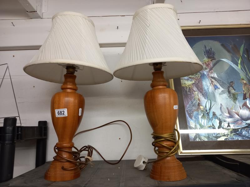 A pair of tall ornate turned wood table lamps. COLLECT ONLY.