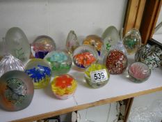 A shelf of assorted paperweights.