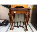 A nest of two walnut veneer tables, missing one glass top. COLLECT ONLY.