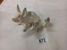 Three Beswick novelty pigs.